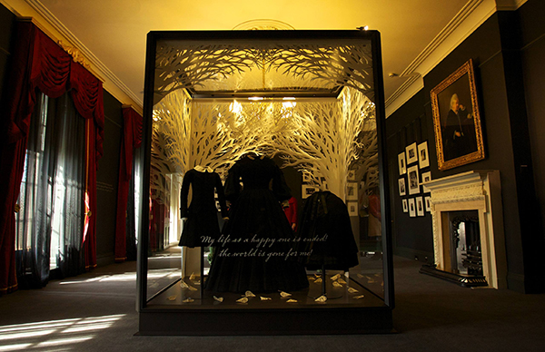 The room explores the mourning period for Victoria's family after Prince Albert's untimely death. The central showcase displays Queen Victoria's earliest surviving mourning dress and two outfits worn by her children, Leopold and Beatrice.