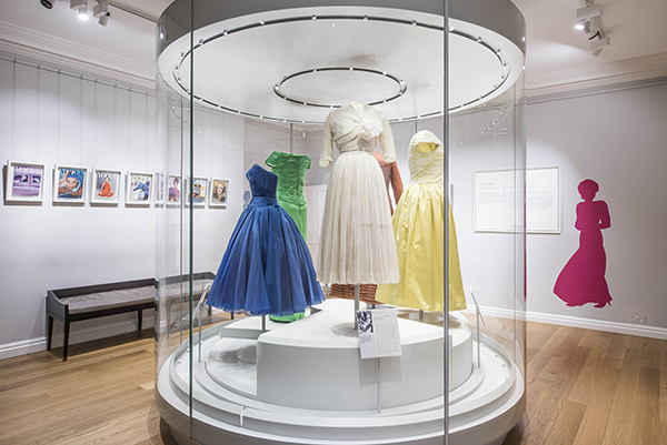 Colour has many symbolic associations and can reflect a variety of emotions. Royal women have used colour to make a strong visual statement and to communicate specific ideas. They have worn black for sombre occasions or mourning, national colours for state visits abroad or ivory, silver and gold for special events such as the state opening of Parliament. The designer Norman Hartnell said ‘unusual and light clear tones are the favourite colours for ladies of the Royal Family, for they must stand out, yet be distinguishable in a subtle and dignified way.’ Used in this way, colour could set the scene. Princess Margaret looked every inch a fairy tale princess in white silk chiffon. Diana, Princess of Wales lit up a red carpet in a startling green gown by Catherine Walker. The overall impact of colour became even more important from 1960s when newspapers such as The Sunday Times began to print colour supplements.(c) Historic Royal Palaces